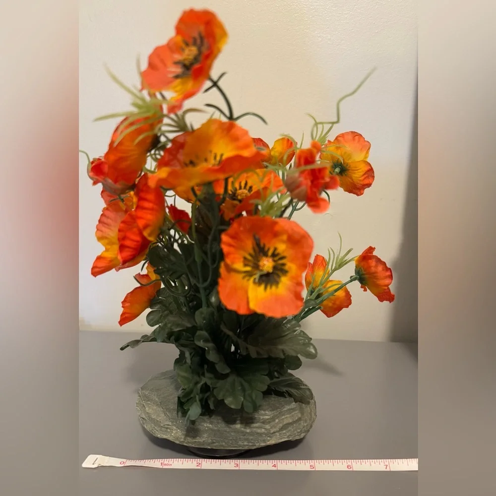 Vibrant Orange Floral Arrangement With Stone Holder